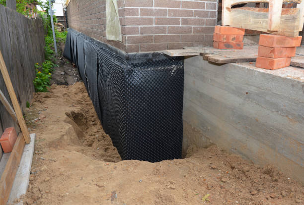 Happy homeowners after waterproofing job in Hempstead